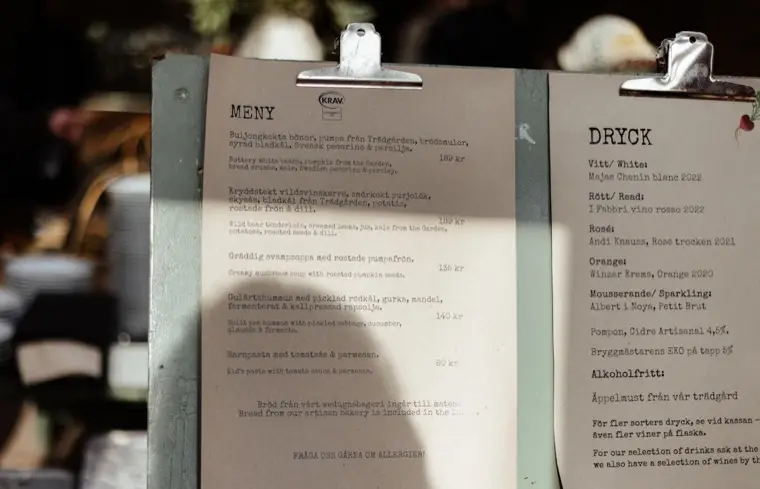 Paper restaurant menu photographed on a table